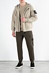 Бежевая куртка с капюшоном и логотипом мужская Stone Island - логотип бренда . капюшон. 92% полиэстер, 8% эластан. кнопки, молния. два боковых кармана. Страна производитель: Италия. Уход: специализированная чистка - фото 2