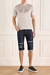 Шорты из хлопка синие мужские Philipp Plein - эффект потертости, прорехи. 98% хлопок, 2% эластан. молния, пуговица. три боковых кармана, два кармана сзади. Страна производитель: Германия. Уход: специализированная чистка - фото 2