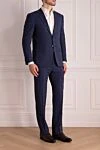 Corneliani Костюм мужской из шерсти синий - Декор: Шлица, узор клетка. Состав: 100% шерсть. Застежка: Пуговицы, крючок. Карманы (внешние): Нагрудный карман, два кармана с клапанами. Карманы (внутренние): Три кармана. Карманы брюк: Два боковых кармана, два кармана сзади на пуговицах. Подкладка: 100% купро. Страна производитель: Италия. Уход: специализированная чистка - фото 3