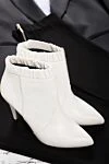 Celine Women's white leather ankle boots with buttons and elastic inserts - folds of leather on the free. genuine leather. Heel height: 5 centimeters. Country of manufacture: Italy. Care: specialized cleaning - photo 3