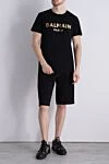 Чорна бавовняна футболка з контрастним золотистим логотипом (уцінка) Balmain - набивка логотипу бренду. 100% бавовна. Країна виробник: Італія. Догляд: спеціалізоване чищення - фото 2