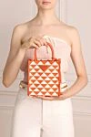 Prada Orange textile bag for women - triangular metal logo, geometric pattern all over the surface. textile. zipper. Country of manufacture: Italy. Care: specialized cleaning - photo 1