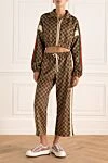 Костюм прогулянковий з поліестеру та бавовни коричневий жіночий Gucci - логотип по поверхні. дві кишені. 55% поліестер, 45% бавовна. еластичний пояс з зав'язкою, блискавка. Країна виробник: Италия. Догляд: спеціалізоване чищення - фото 2