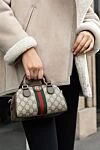 Gucci Сумка из кожи коричневая женская - позолоченная фурнитура, контрастная полоска, металлический логотип. молния. натуральная кожа, текстиль. Страна производитель: Италия. Уход: специализированная чистка - фото 7