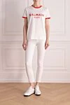 Футболка из хлопка женская белая Balmain - логотип, окантовка на воротнике и рукавах. 100% хлопок. Страна производитель: Франция. Уход: специализированная чистка - фото 2
