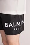 Balmain Men's black polyester shorts with logo - brand logo. 100% polyester. Closure: drawstring. two side pockets. Country of manufacture: Italy. Care: specialized cleaning - photo 5