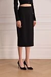 Dolce & Gabbana Юбка из шерсти и эластана черная женская - логотип бренда. 98% шерсть, 2% эластан. молния. Страна производитель: Италия. Уход: специализированная чистка - фото 3