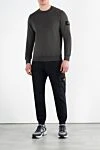 Мужские брюки синие с эластичным поясом Stone Island - логотип бренда. 97% хлопок, 3% эластан. два боковых кармана, два кармана на штанинах, один задний карман. Страна производитель: Италия. Уход: специализированная чистка - фото 2