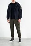 Синяя ветровка с логотипом и капюшоном мужская Stone Island - логотип бренда . капюшон. 92% полиэстер, 8% эластан. кнопки . два боковых кармана. Страна производитель: Италия. Уход: специализированная чистка - фото 2