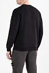 Свитшот мужской черный из хлопка с карманом на рукаве Stone Island - логотип бренда. 100% хлопок. карман на молнии на рукаве. Страна производитель: Италия. Уход: специализированная чистка - фото 4