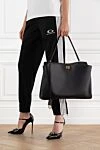Women's Rodeo Bag in Black Smooth Calfskin Balenciaga - antique gold hardware. Material: 100% genuine leather. Dimensions: L40 x H30 x W13 cm. Belt length: removable shoulder strap (height: 57 cm). Wide front pocket, internal zip pocket,. 2 flat pockets at the back. twist lock. Country of manufacture: Italy. Care: specialized cleaning - photo 2