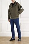 Ветро- и водонепроницаемая куртка с капюшоном зеленая мужская Stone Island - логотип бренда. капюшон. 92% полиэстер, 8% эластан. два боковых кармана. молния, кнопки. Страна производитель: Италия. Уход: специализированная чистка - фото 2