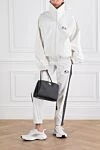 Спортивный костюм Dirty White белый с логотипом Balenciaga - логотип бренда, лампасы на штанинах. 100% полиэстер. застежка-молния. два боковых кармана. Страна производитель: Италия. Уход: специализированная чистка - фото 2