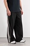 Balenciaga Чоловічі спортивні штани чорного кольору з вишитим спортивним значком - логотип бренду . 100% поліестер. еластичний пояс. дві бічні кишені. Країна виробник: Італія. Догляд: спеціалізоване чищення - фото 3