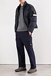 Темно-серый пуховик с высоким воротником и пуговицами Stone Island - эмблема бренда. 100% полиамид. 2 боковых кармана. молния, кнопки. Утеплитель: пух. Страна производитель: Италия. Уход: специализированная чистка - фото 2