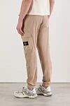 Брюки-карго бежеві звуженого крою з поясом на шнурівці Stone Island - фірмовий патч. 97% бавовна, 3% поліамід. блискавка, куліска. Кишені дертикальні бічні кишені з потайною блискавкою. Накладні кишені-гармошки з клапаном та потайною подвійною кнопкою. Задня кишеня з фіксованим клапаном та потайною кнопкою. Країна виробник: Італія. Догляд: спеціалізоване чищення - фото 4