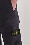 Stone Island Сині штани-карго звуженого крою з поясом на шнурівці - фірмовий патч. 97% бавовна, 3% поліамід. блискавка, куліска. Кишені дертикальні бічні кишені з потайною блискавкою. Накладні кишені-гармошки з клапаном та потайною подвійною кнопкою. Задня кишеня з фіксованим клапаном та потайною кнопкою. Країна виробник: Італія. Догляд: спеціалізоване чищення - фото 5