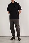 Черное поло стандартного кроя с короткими рукавами и вышитым логотипом Stone Island - логотип бренда. 100% хлопок . пуговицы. Страна производитель: Италия. Уход: специализированная чистка - фото 2