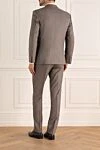 Костюм мужской из шерсти бежевый Brioni - Шлица. 100% шерсть. Пуговицы, крючок. Нагрудный карман, два кармана с клапанами. Карманы (внутренние): Три кармана. Два боковых кармана, два кармана сзади на пуговицах. 100% купро. Страна производитель: Италия. Уход: специализированная чистка - фото 4