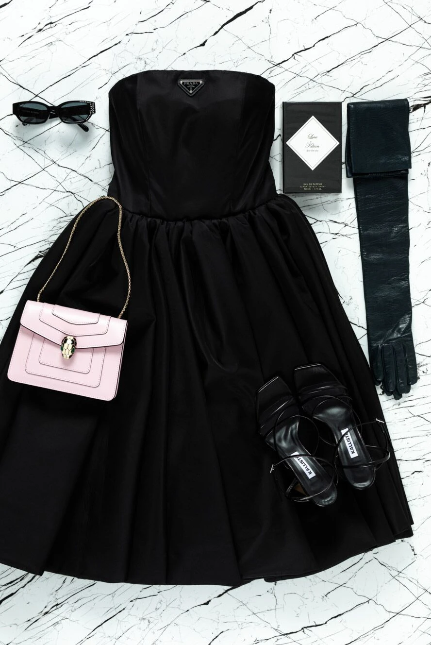 Prada minimalist black dress with a full fit and cold shoulders